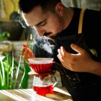 barista smelling the filter coffee while making it - food stock pictures, royalty-free photos & images