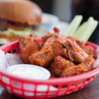 basket of chicken wings - junk food stock pictures, royalty-free photos & images