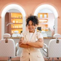 beautician exuding confidence and professionalism, smiling in a stylish beauty salon while offering top notch services with joy - hairstyle stock pictures, royalty-free photos & images