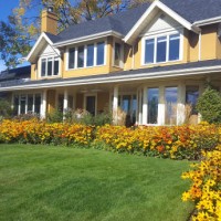 beautiful bright and cheery tradional home on a lovely autumn afternoon - garden decoration stock pictures, royalty-free photos & images