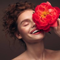 beautiful emotional woman holding a flower - fashion stock pictures, royalty-free photos & images