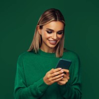 beautiful emotional woman holding smart phone - fashion stock pictures, royalty-free photos & images