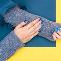 beautiful female hands holding yellow cup. manicure with blue nail polish. cozy concept, copy space - nails art stock pictures, royalty-free photos & images
