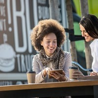 beautiful females on a coffee break - junk food stock pictures, royalty-free photos & images