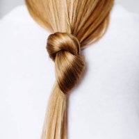 beautiful healthy long hair tied in a knot. - hairstyle stock pictures, royalty-free photos & images