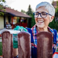 beautiful mature women painting fence - garden decoration stock pictures, royalty-free photos & images
