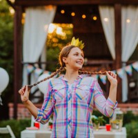 beautiful teen girl with mouth braces posing against decorated birthday zone - garden decoration stock pictures, royalty-free photos & images