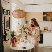 beautiful woman decorating house with flowers. - home decoration stock pictures, royalty-free photos & images