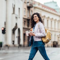 beautiful woman having her breakfast in the city - junk food stock pictures, royalty-free photos & images