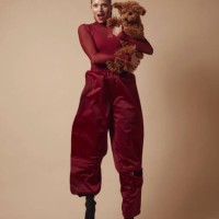 beautiful woman jumping with cute dog in her arms. - fashion stock pictures, royalty-free photos & images