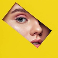 beautiful woman looking through a rectangle hole - fashion stock pictures, royalty-free photos & images