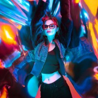 beautiful woman with eyeglasses standing against colored plastic wrap with neon lights,china - fashion photos et images de collection