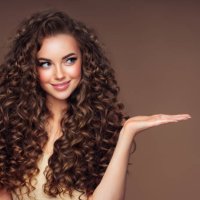 beautiful woman with voluminous curly hairstyle - hairstyle stock pictures, royalty-free photos & images