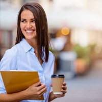 beautiful young business woman smiling and holding documents and - junk food stock pictures, royalty-free photos & images