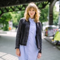 beautiful young woman walking along city street - fashion stock pictures, royalty-free photos & images