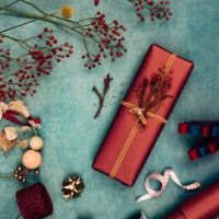 beautifully wrapped christmas present surrounded by various christmas decorative items, a flat lay - home decoration stock pictures, royalty-free photos & images