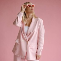 beauty shot of beautiful woman in monochromatic pink wearing heart-shaped glasses - fashion stock pictures, royalty-free photos & images