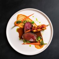beef deer steak filet with gravy, carrot puree and carrot cake served with red wine at michelin star gourmet restaurant - food stock pictures, royalty-free photos & images