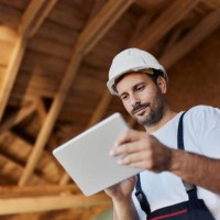 below view of manual worker using touchpad at construction site. - home decoration stock pictures, royalty-free photos & images
