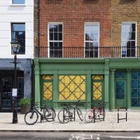 bicycles on bike racks along sidewalk in residential area of london, england - fashion stock pictures, royalty-free photos & images