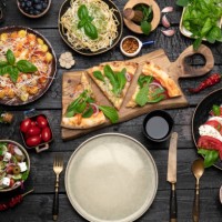 big dinner table with italian food, pizzas and pastas - food stock pictures, royalty-free photos & images