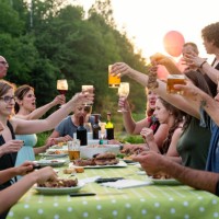 big family barbecue gathering at sunset, summer outdoors. - garden decoration stock pictures, royalty-free photos & images