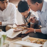 big family eating take-out food together - junk food stock pictures, royalty-free photos & images