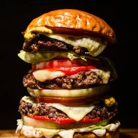 big hamburger on black - junk food stock pictures, royalty-free photos & images