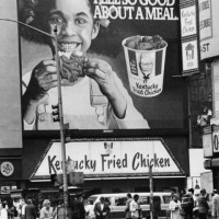 Billboard over a Kentucky Fried Chicken fast food outlet in New York City, 1980.
