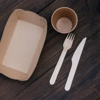 biodegradable disposable tableware made of recyclable plastic and paper on wood background or table. the concept of protection, care and environmental protection. life without plastic - junk food stock pictures, royalty-free 