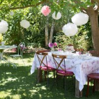 birthday table set-up in garden decorated with laterns - garden decoration stock pictures, royalty-free photos & images