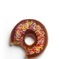 bite out of donut with copy space - junk food stock pictures, royalty-free photos & images