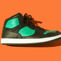 black and green basketball sneakers, on a orange background. concept for sneaker, basketball, retro, fashion, collection and casual - fashion stock pictures, royalty-free photos & images