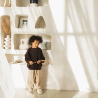 black boy wearing brown sweater and beige hat. - fashion stock pictures, royalty-free photos & images