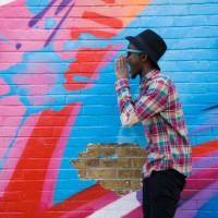 black man in sunglasses shouting near colorful wall - fashion stock pictures, royalty-free photos & images