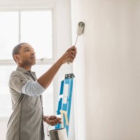 black man painting wall of home - home decoration stock pictures, royalty-free photos & images