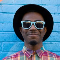 black man wearing sunglasses near colorful wall - fashion stock pictures, royalty-free photos & images
