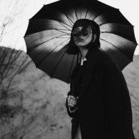 black white photography. redhead girl in black clothes outdoors. gothic style. asian fashion model in dark coat with umbrella on nature. bw photo. stylish outfit. subculture. monochrome. desaturated - fashion stock pictures, 