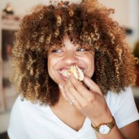 black woman biting sandwich - food stock pictures, royalty-free photos & images