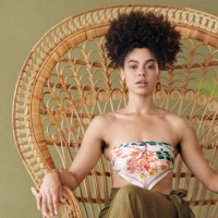 black woman on throne chair, queen empowerment in portrait and trendy african designer fashion in jamaica. sitting on olive background in studio, beauty in creative culture and young confident girl - fashion stock pictures, r