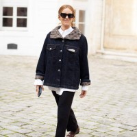 Blanca Miro wears navy blue denim jacket, white top, navy blue jeans and sunglasses outside the Ganni fashion show during the Womenswear Fall/Winter...