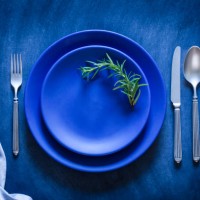 blue toned place setting shot from above on dark background - food stock pictures, royalty-free photos & images