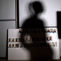Board with photographs of models are seen backstage before the araisara Sara Arai Collection show during China Fashion Week in Beijing on March 27,...