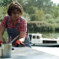 boat diy restoration. scraping off old blue paint from rusted metal surface - garden decoration stock pictures, royalty-free photos & images