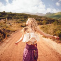 boho girl on a country dirt road being joyful - fashion stock pictures, royalty-free photos & images