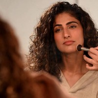 Bollywood actress Kubra Sait gets dressed backstage at the Lakme Fashion Week x FDCI, in Mumbai on March 28, 2025.