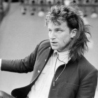 Bono performs with his band U2 at Live Aid, Wembley Stadium, London, and event to raise money to ease the famine in Ethiopia. U2 performed two songs...