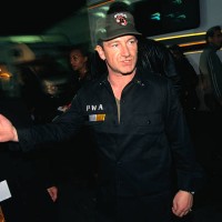 Bono, the lead singer of U2, prepares to perform at the NetAid Concert, to help fight extreme poverty.