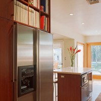 bookshelves over stainless steel refrigerator - home decoration stock pictures, royalty-free photos & images