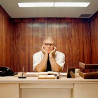 bored man sitting at desk - hairstyle stock pictures, royalty-free photos & images